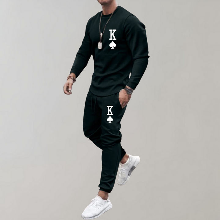 Schwarzer Herren-Trainingsanzug mit Karo-Design, Langarmshirt und Jogginghose, sportlich, modern.