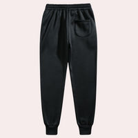 Schwarze Jogginghose, elastischer Bund, Seitentasche, Baumwolle, Herrenmode, bequem.
