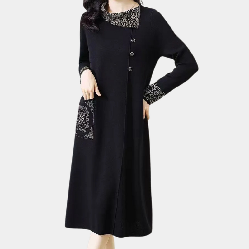 Schwarzes Damenkleid mit Spitze, Knöpfen und Tasche, elegantes Design, langärmelig.