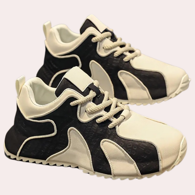 Schwarz-weiße Sneaker, Lederoptik, sportlich, modisch, Unisex, rutschfeste Sohle, Schnürsenkel.
