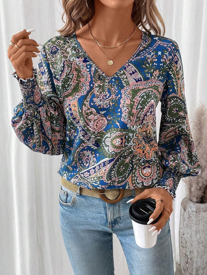 Blusa de mujer con estampado floral, escote en V y mangas farol – Malina