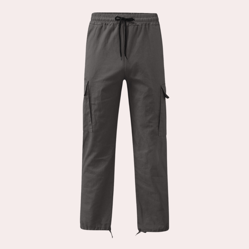 Graue Cargo-Hose aus Baumwolle mit elastischem Bund und Kordelzug, seitliche Taschen.