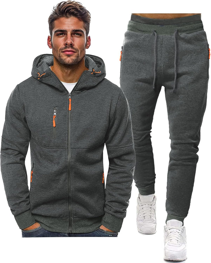 Grauer Trainingsanzug: Kapuzenjacke mit orangen Reißverschlusszippern und Jogginghose mit Kordelzug, freigestellt 7