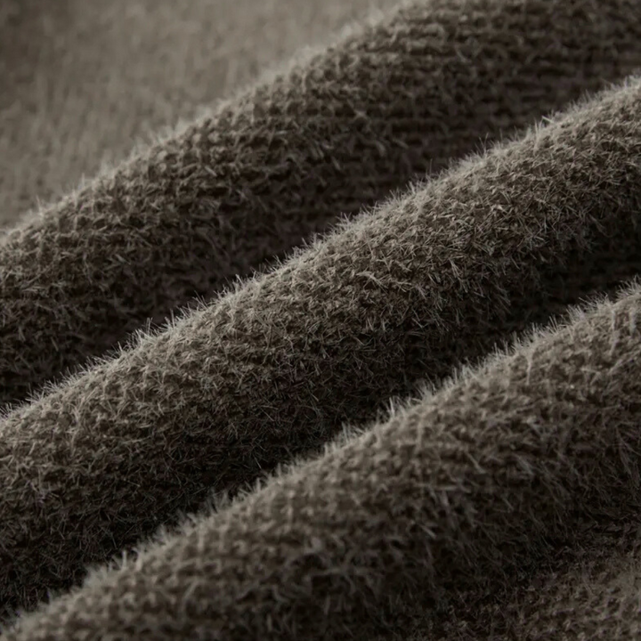 Brauner Wollstoff, Nahaufnahme, weiche Textur, hochwertige Bekleidungsmaterialien, gemütlich.