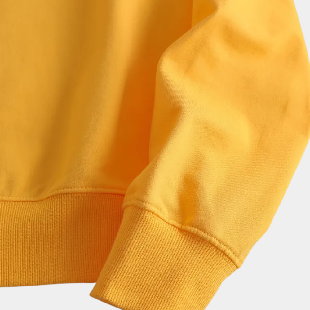 Gelber Baumwollpullover, langärmlig, weiches Material, modisch, bequem, Freizeitkleidung.