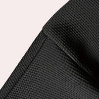 Schwarzer Stoff mit texturierter Oberfläche, Nahaufnahme, hochwertiges Material, Detailansicht.